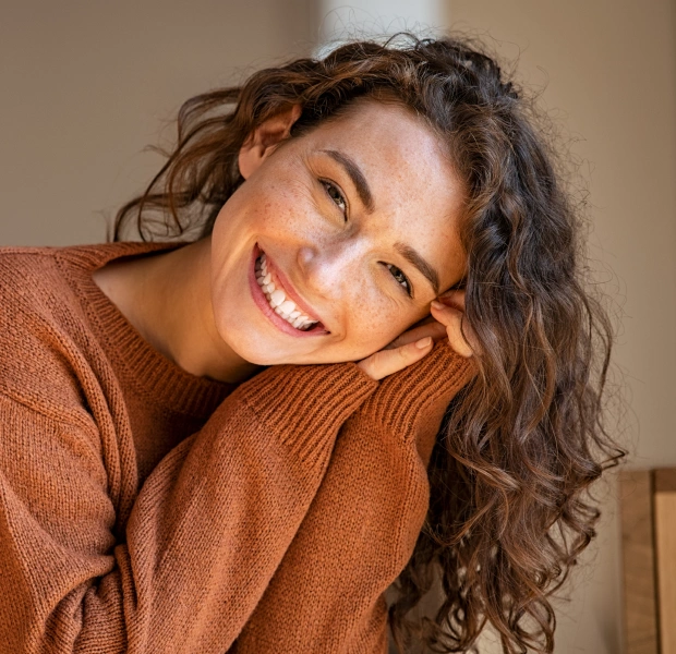 Patient smiling after cosmetic dentistry treatment at Saginaw Family Smiles