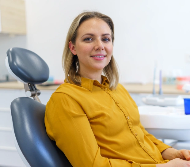 Patient receiving a professional dental cleaning and comprehensive oral exam