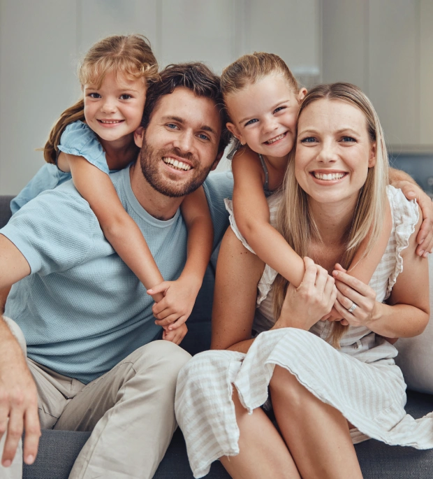 Happy family smiling after receiving personalized dental care in Saginaw, MI