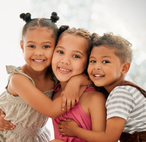 Children smiling during a family-friendly dental visit in Saginaw, MI