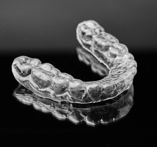 Custom night guard designed to protect teeth from grinding and clenching