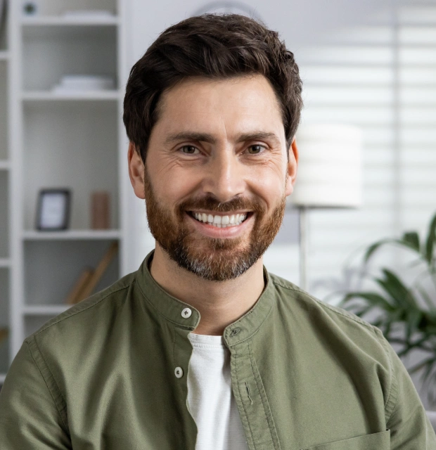 Patient showing brighter teeth after professional teeth whitening