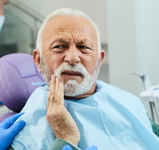Patient receiving compassionate tooth extraction treatment in Saginaw, MI